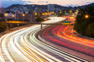 High angle view of light trails on road at night