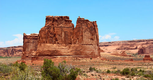 View of rock formation against blue sky