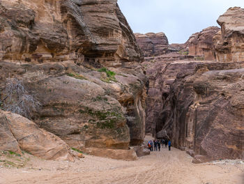 People walking on rocks