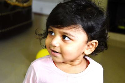 Portrait of cute girl at home