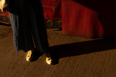 Low section of woman standing on floor