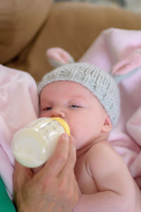 Close-up portrait of cute baby holding ice cream