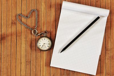 High angle view of clock on table