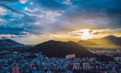 Aerial view of townscape against sky during sunset