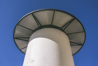 Low angle view of tower against clear blue sky