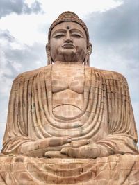 Low angle view of buddha in mediation 