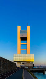 Low angle view of building against clear blue sky