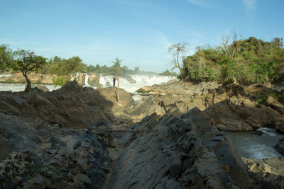 Panoramic view of rocks on landscape against sky