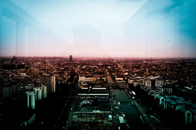 Aerial view of cityscape against sky