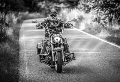 Man riding bicycle on road