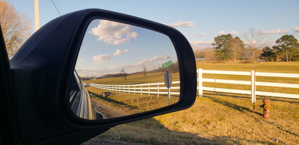 Reflection of road on side-view mirror