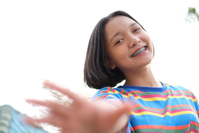 Portrait of teenage girl standing outdoors