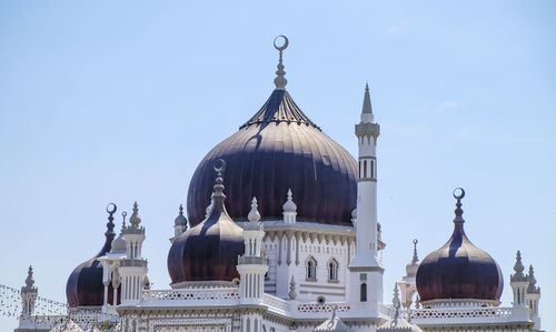 Low angle view of mosque against sky