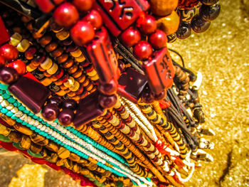 Close-up of multi colored jewelry for sale in market