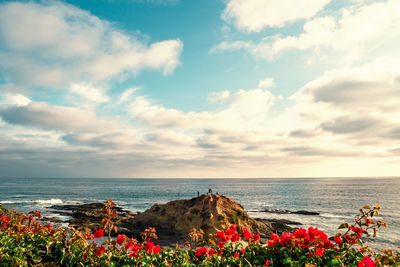 Scenic view of sea against cloudy sky