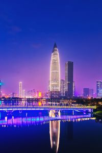 Illuminated buildings in city at night