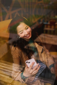 Young woman using mobile phone