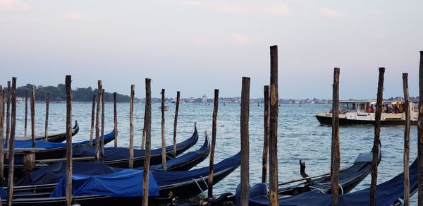 Gondolas moored in canal