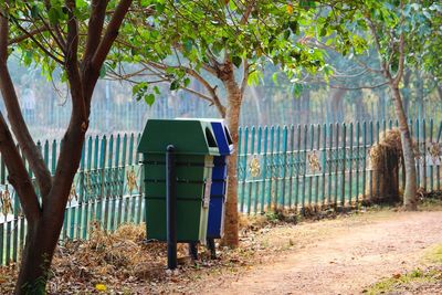 Collection of dry waste and wet waste bins in a park