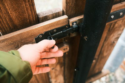 Close-up of hand holding metal