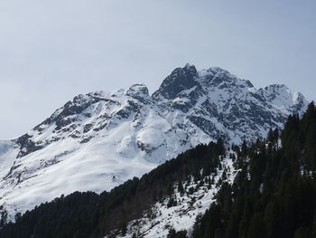 Scenic view of snowcapped mountains against clear sky