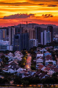 High angle view of buildings against sky during sunset