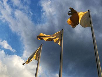 Low angle view of flag against sky