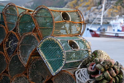 Close-up of lobster traps at harbor