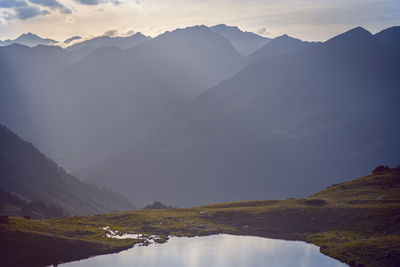 Scenic view of mountains against sky during sunset