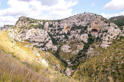 Scenic view of rocky mountains against sky