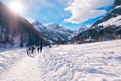 Scenic view of snow covered mountains against sky