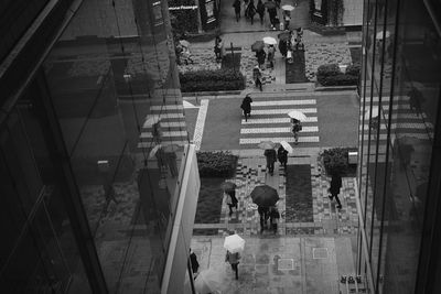 High angle view of people walking on steps in city