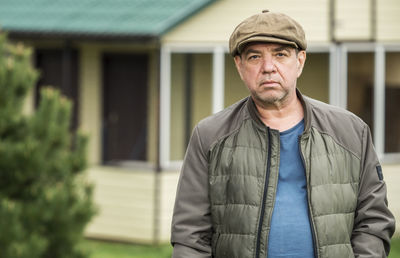 Portrait of man standing outdoors