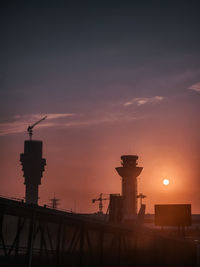 Low angle view of lighthouse against sky during sunset