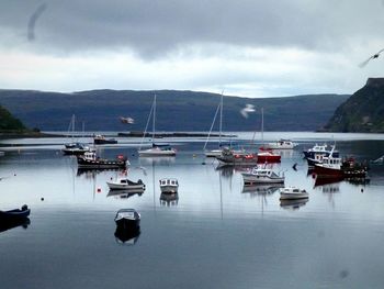 Scenic view of lake against cloudy sky