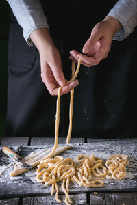 Midsection of man preparing food