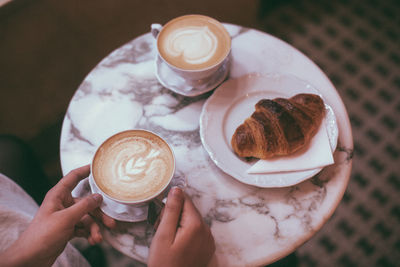 High angle view of coffee cup on table