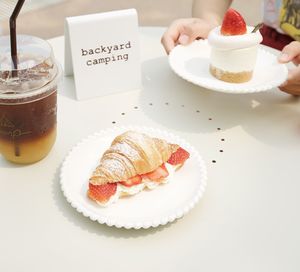 High angle view of cake with coffee on table