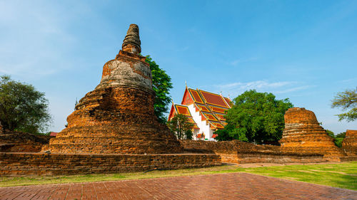 Low angle view of old temple building against sky