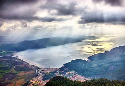 Scenic view of mountains against cloudy sky