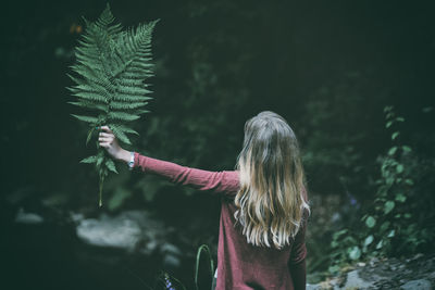 Woman against plants