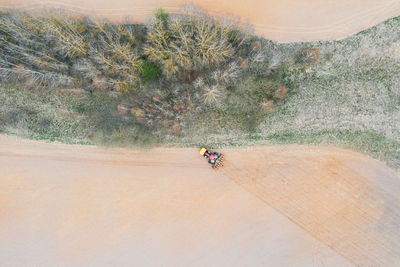 Agricultural machine cultivates the land. the view from the top. plowing land for planting crops.