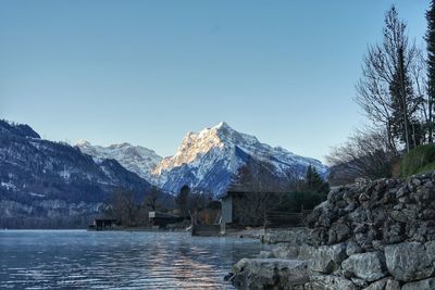 Scenic view of snowcapped mountains against clear sky