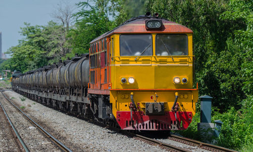 Train on railroad track against sky