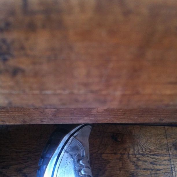 wood - material, wooden, wood, plank, part of, shoe, indoors, one person, close-up, built structure, cropped, day, wall - building feature, brown, architecture, high angle view, weathered, personal perspective