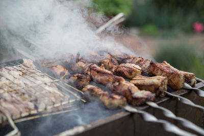 Close-up of meat on barbecue grill