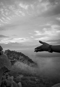 Person on shore against sky