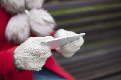 Close-up of hand holding hat