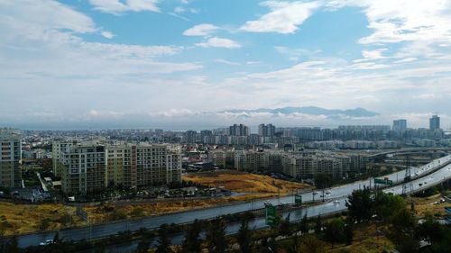 High angle view of buildings in city against sky