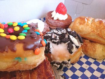 Cronuts and donuts on checked pattern table